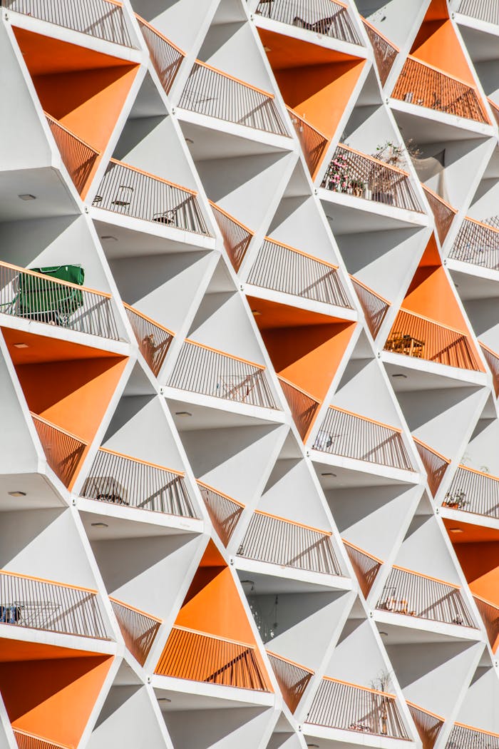 Dynamic view of geometric apartment balconies in Dubai with vibrant colors.